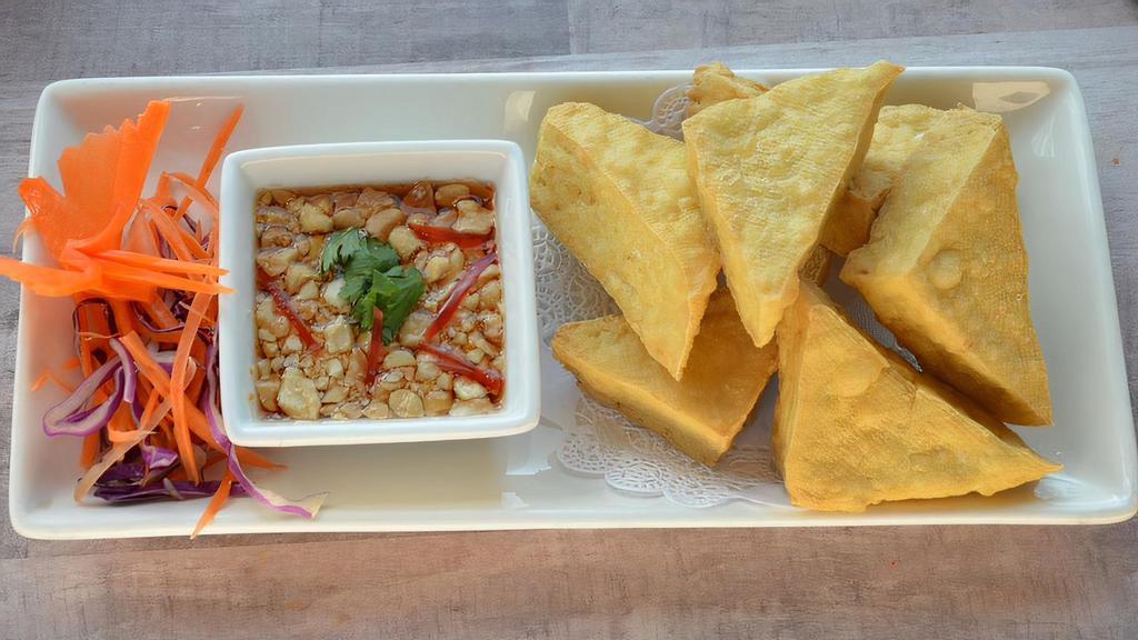 Fried Tofu (8 Pcs) · Eight pieces of deep-fried tofu served with crushed peanuts and sweet and sour sauce.