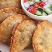 Curry Puffs (6 Puffs) · Seasoned ground chicken, dice potato and onions with curry power wrapped in pastry served wi...