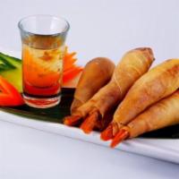 Appetizer Sampler · A combination of one spring roll, one golden shrimp roll, one curry puff and one crab rangoo...