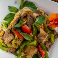 Drunken Noodles · Sautéed rice noodles with egg, bell peppers, basil, and Thai sweet brown sauce.
