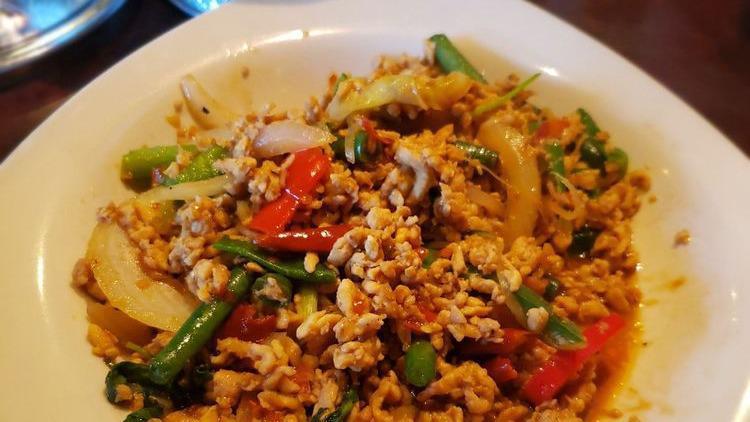Pad Gra Prow Gai · Mince chicken stir-fry with holy basil, bell peppers, onions, green onions, string bean in basil chilli paste.