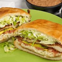 Tortas · Telera bread with choice of meat, lettuce, tomato, beans, mayo, onions, cheese and sour cream.