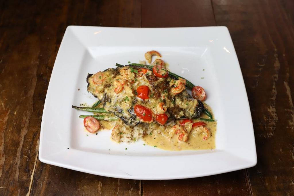Blackened Catfish · pan seared, dirty rice, sautéed baby green beans, creole beurre blanc with crawfish and grape tomato