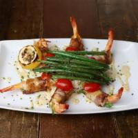 Gulf Shrimp En Brochette · grilled, applewood smoked bacon wrapped, stuffed with jack cheese and jalapeño, dirty rice, ...