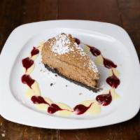 Chocolate Cheesecake · cookie crumb, raspberry coulis, cardamom anglaise, fresh mint