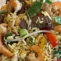 Arroz Chaufa - Peruvian Fried Rice · Gluten free.
Fried rice with Sirloin or Chicken, scrambled eggs, green onions, bean sprouts,...