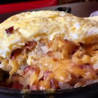 Meat Lovers Skillets · Hash brown, ham, bacon, sausage, with cheddar cheese, two eggs any style with pancakes or to...