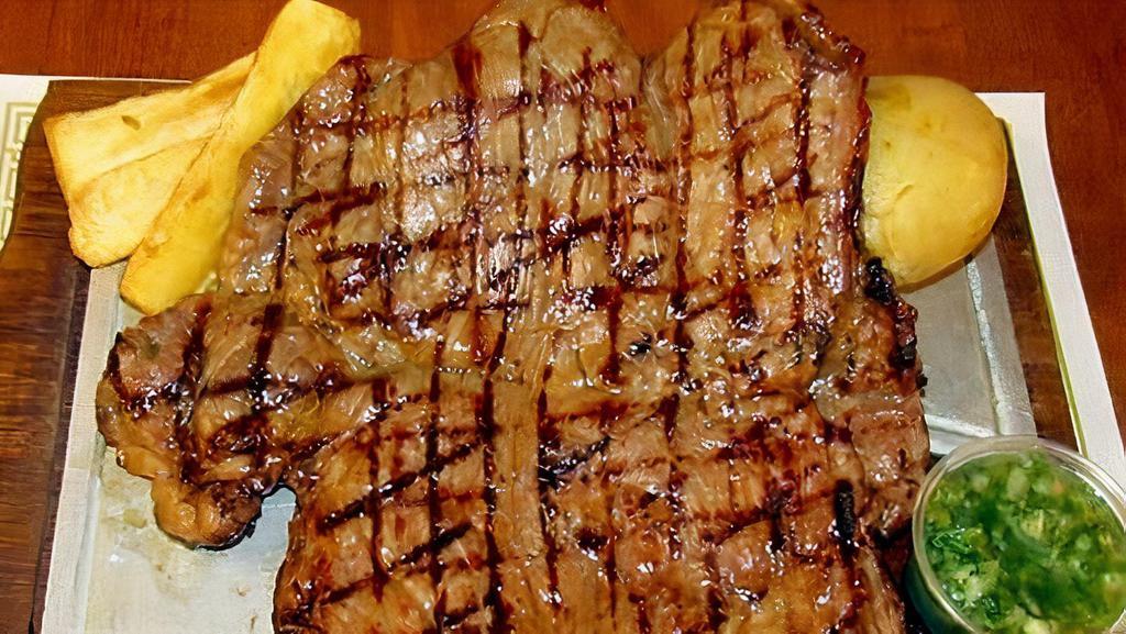 Churrasco · Char-broiled new York strip steak. Served with potato, cassava, and plantain.