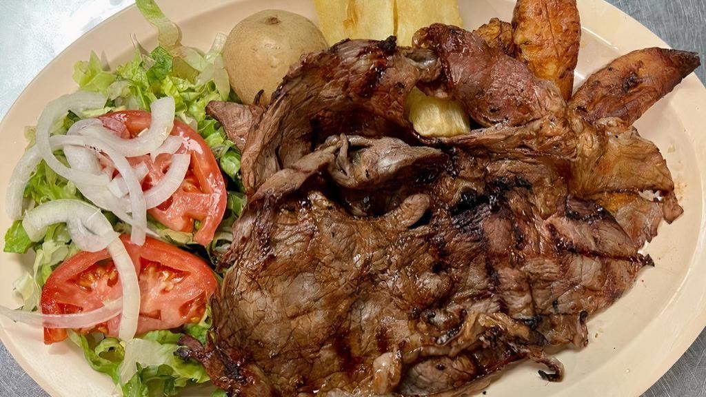 Carne Asada · Char-broiled carne asada steak. Served with potato, cassava, plantain, and salad. This steak is thin cut.