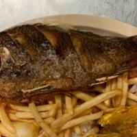 Mojarra Frita Al Ajo (Cooked In Garlic) · Fried tilapia fish with garlic. Served with plantain, cassava, rice, French fries, and salad.