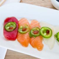 Yuzu In Truffle · Thinly sliced tuna, salmon, yellowtail, white tuna, topped with jalapeno & cilantro.
