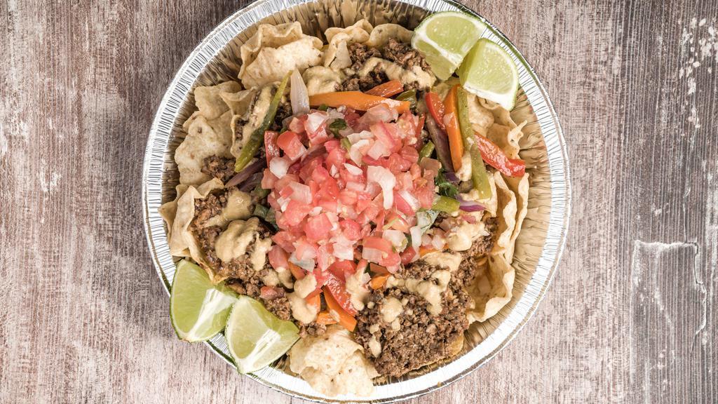 Classic Nachos  · Ground walnut mixture seasoned to perfection. First comes the meat mixture. topped off  with our house made Pico and cilantro-lime vinaigrette, over a bed of tortilla chips and our delicious  cashew based naCHO Cheez!