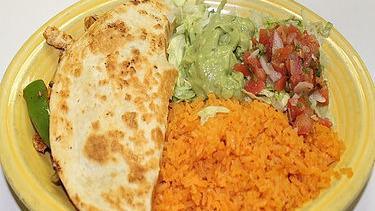 Fajita Quesadilla · Choice steak or chicken. Grilled with fajita veggies beans and cheese. Complemented with pico de gallo, lettuce, tomatoes, sour cream and a side of rice.