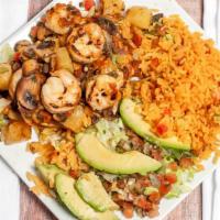 Pollo Cancun · Chicken breast and shrimp accompanied by a mixture of pineapple, pico de gallo and mushrooms...