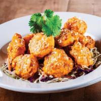 Boom Boom Shrimp · Lightly breaded shrimp tossed in our signature boom boom sauce served on top of dry slaw