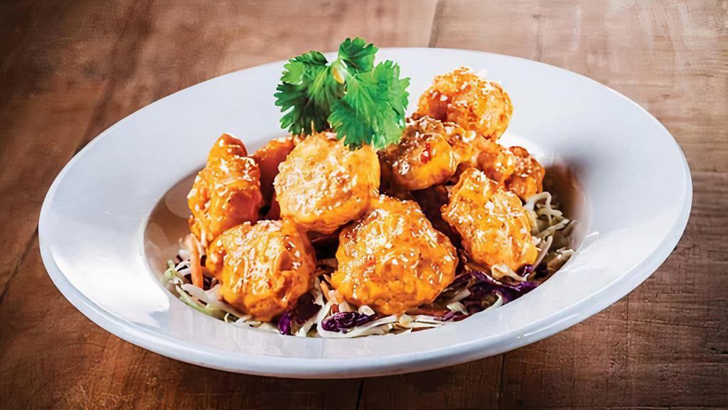 Boom Boom Shrimp · Lightly breaded shrimp tossed in our signature boom boom sauce served on top of dry slaw
