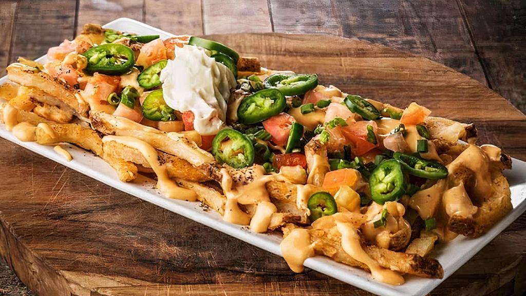 Stadium Fries · Cheese Sauce, Tomato, Jalapeno, Scallion, Served With a Side of Sour Cream