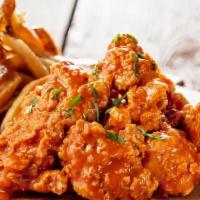 Lg Boneless Wings Fries · 16 Fresh Cut Boneless Wings Deep Fried, Tossed in Your Choice of Wing Sauce, Served With Fries