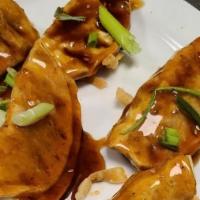 Asian Pot Stickers · Fried Asian Dumplings // Seasoned Chicken // Sesame Bourbon Sauce // Fried Won Tons