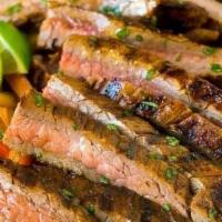 Steak Fajita · Grilled Steak // Sauteed Red & Green Peppers // Onions // Warm Flour Tortillas // Cheddar Ja...