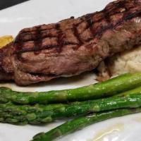 Ny Strip · 14oz  Cut // House Spices // Zip Sauce // Garlic Mashed Potatoes // Herb-Grilled Asparagus