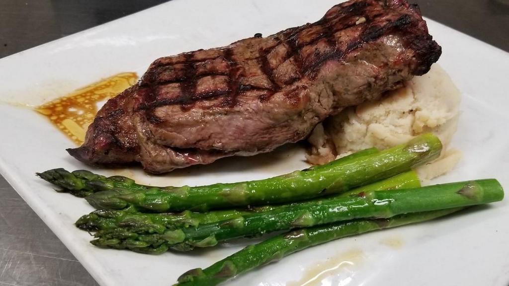 Ny Strip · 14oz  Cut // House Spices // Zip Sauce // Garlic Mashed Potatoes // Herb-Grilled Asparagus