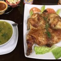 1/4 De Pollo Rostisado · Roasted chicken served with rice beans, salad, French and consome.
