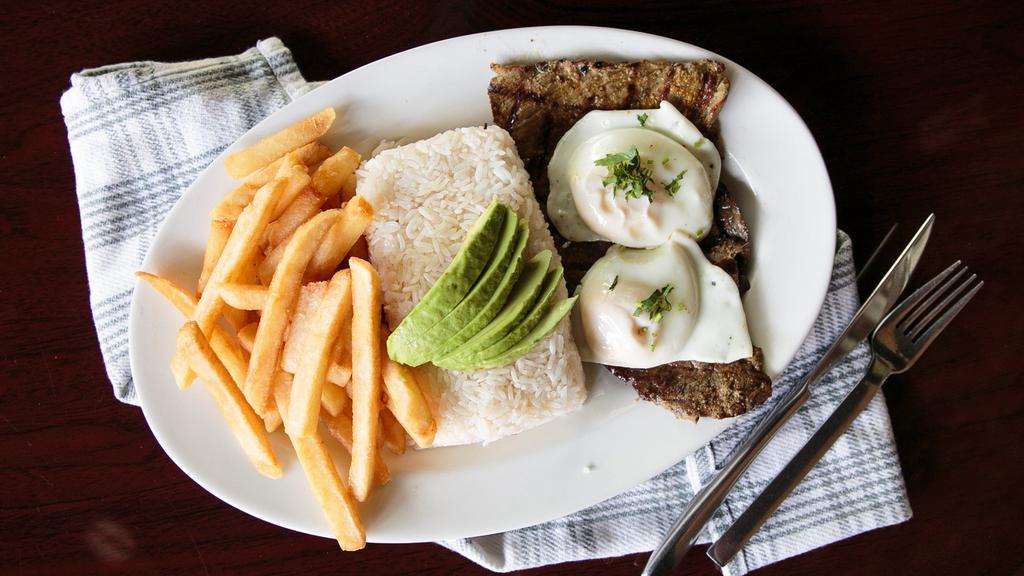 Churrasco · Carne asada o carne en salsa. Choice top round steak grilled, onion, green and red peppers, tomato served with rice, beans two fried eggs, avocado and French fries.