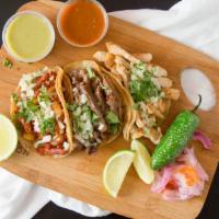 Tacos (Each) · corn tortilla with your choice of meat  topped with cilantro and onion