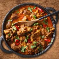 Lamb Rogan Josh · Tender meat well marinated and cooked with ginger, garlic yogurt, onion, tomato, and spiced ...