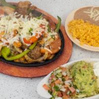 Fajitas · All come with green, red and yellow peppers. Combined with mushrooms, onions and tomato. Ser...