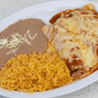 Enchilada Dinner · 3 fried corn tortillas smothered in red or green sauce and filled with cheese. Topped with m...