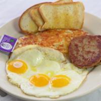 Tony'S Basic Plus · 3 eggs any style with hash browns  choice of meat toast and jelly