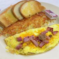 Meat Lovers Omelette 3 Eggs · ham bacon and sausage cheddar cheese toast and jelly
