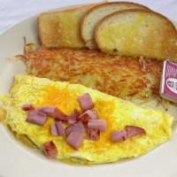 Ham & Cheddar Cheese Omelette · hash browns toast and jelly