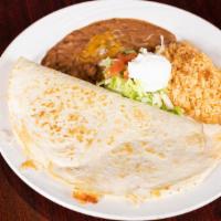 Grande Quesadilla · Big flour tortilla grilled and stuffed with ground beef, chicken or crab meat, and cheese. S...