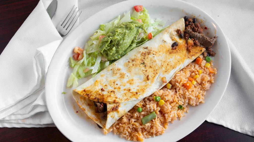 Jorrge'S Burrito · Steak or grilled chicken, black beans, pico de gallo inside a flour tortilla, served with rice, guacamole and sour cream. Garnished with lettuce and tomatoes.