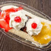 Banana Split · comes with vanilla, chocolate, strawberry ice cream topped with strawberry jam, pineapple ja...