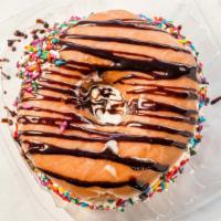 Bliss Ice Cream Sandwich · a glazed donut with vanilla soft serve ice cream in between, and sprinkles and chocolate syr...