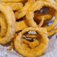 Onion Rings · Sweet onion slices dipped in a premium beer batter, then deep-fried golden brown.