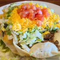 Taco Salad Bowl · A fresh fried tortilla shell filled with lettuce, your choice of seasoned beef or chicken, b...