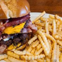 Jonesy'S Ultimate Bacon Burger · Burger patty served on a toasted bun, topped with six slices of bacon, Swiss and American ch...