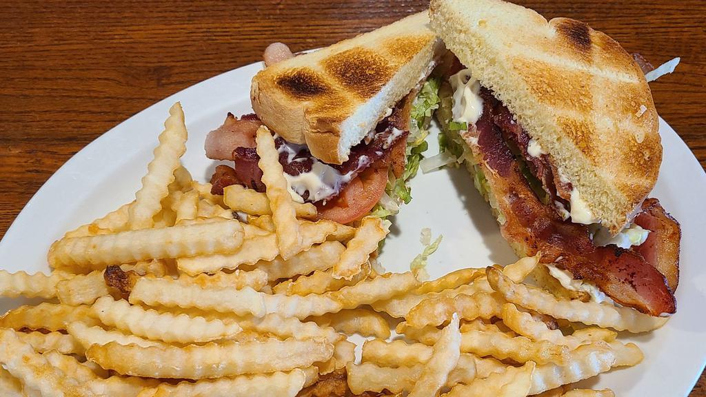 Blt · Toasted Texas toast or flour wrap with lettuce, tomato, and mayo, double the bacon at additional cost.