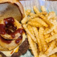 The Cowboy · Burger patty served on a toasted bun, topped with both American and Swiss cheese, crispy oni...