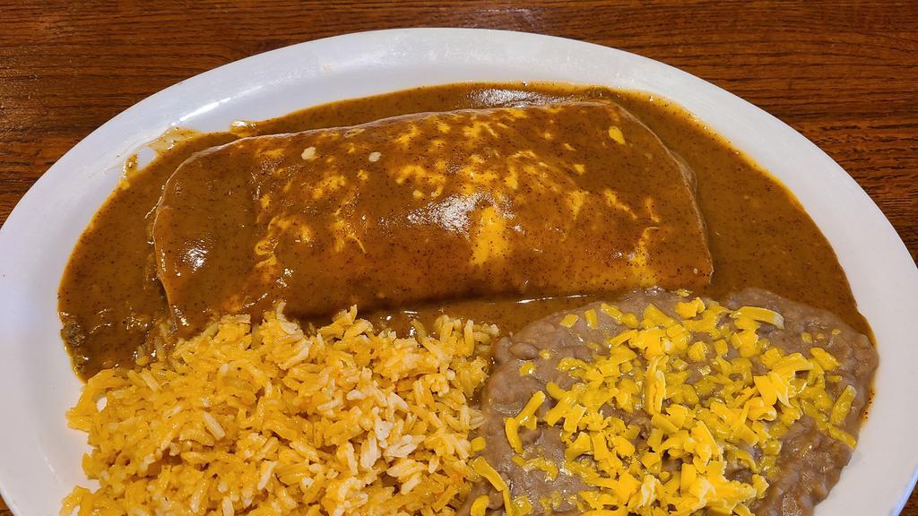 Enchilada · One beef and cheese enchilada, served with beans and rice.