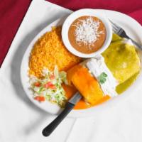 Burrito Bandera · Filled with your choice of meat chicken, pork, shredded beef or ground beef refried beans, l...