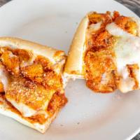 Chicken Parm Sandwich · Battered chicken, our basil marinara and mozzarella cheese - on a sesame seed roll.