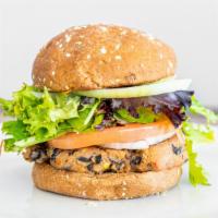 Veggie Burger · House made, black bean, chipotle patty, lettuce, tomato and onion on an oat topped wheat bun.