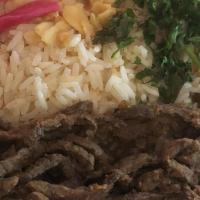 Shawarma Plate · Chicken or beef fresh shredded of the rotisserie with salad or hummus served with rice or gr...