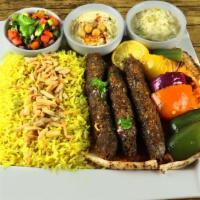 Shish Kafta · Three skewers of fresh ground beef and lamb mixed with parsley, garlic and onion seasoned wi...